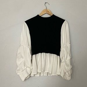 Layered sweater set.